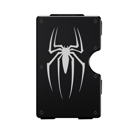 The Arachnid aluminum wallet in Nero Abisso black, front engraved with a large spider emblem