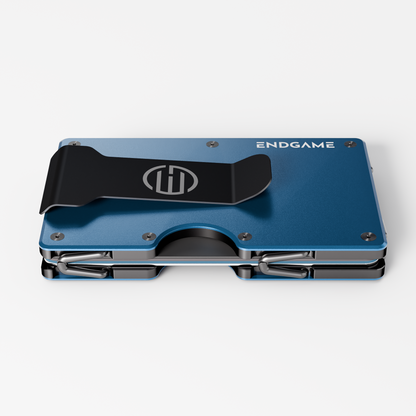 Back of an Endgame Carry aluminum wallet in Blu Ionio blue, showing the stainless steel money clip and cards held between the plates