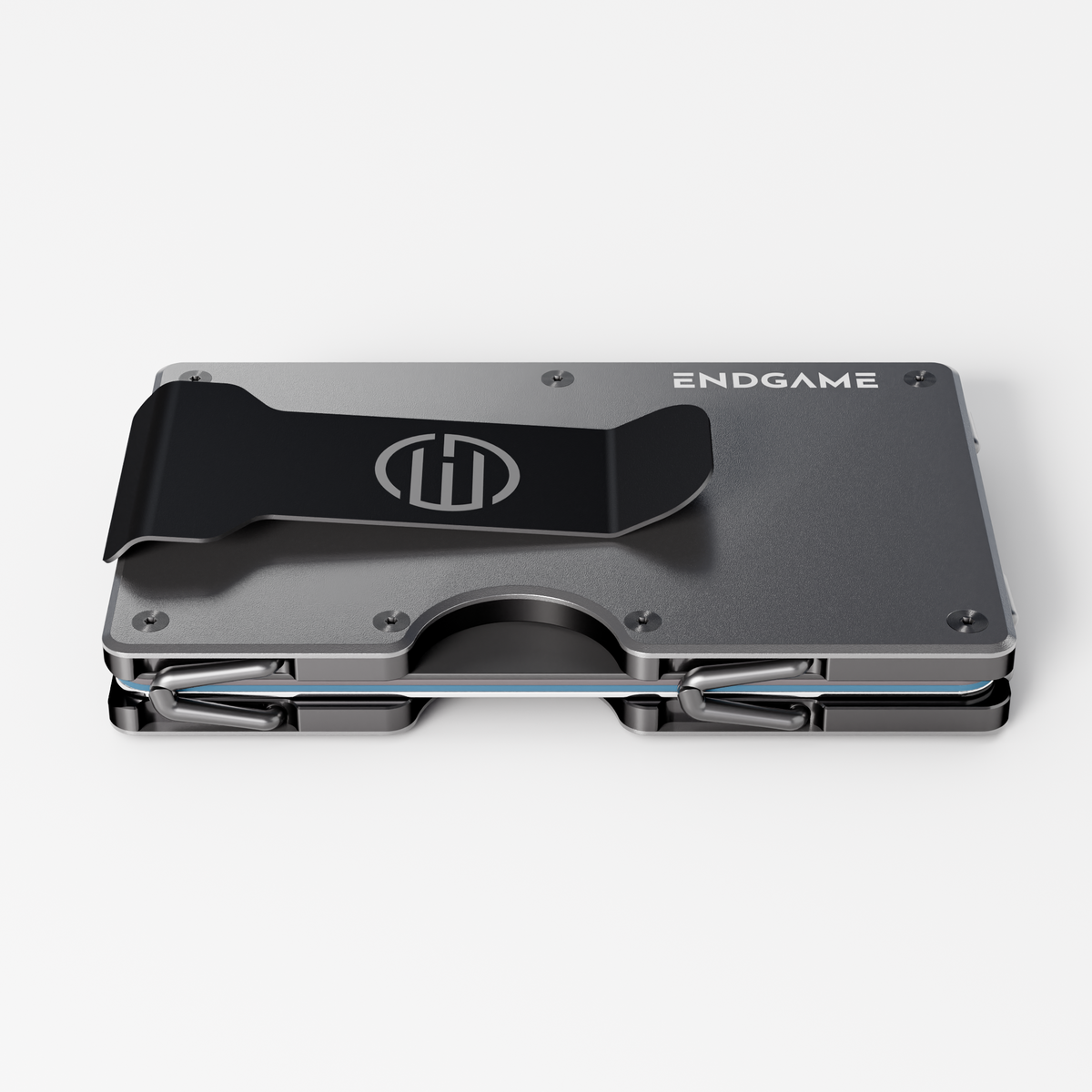 Back of an Endgame Carry aluminum wallet in Grigio Ferro grey, showing the stainless steel money clip and cards held between the plates