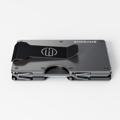 Back of an Endgame Carry aluminum wallet in Grigio Ferro grey, showing the stainless steel money clip and cards held between the plates