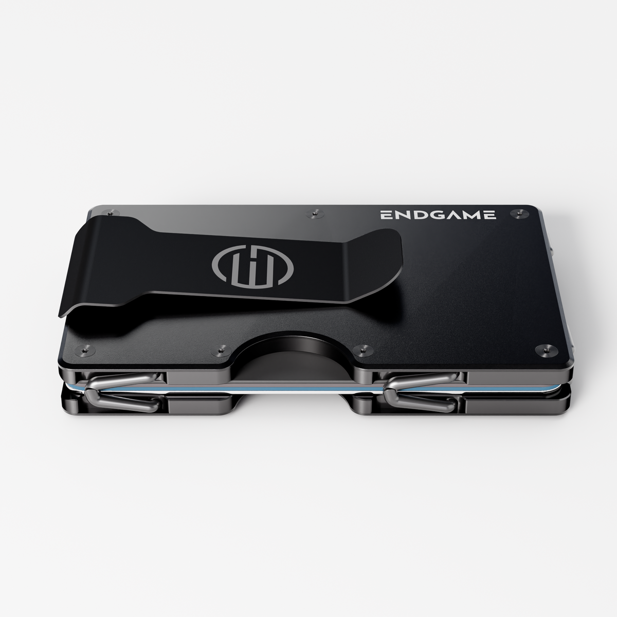 Back of an Endgame Carry aluminum wallet in Nero Abisso black, showing the stainless steel money clip and cards held between the plates