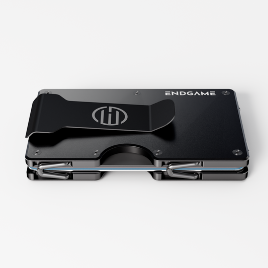 Back of an Endgame Carry aluminum wallet in Nero Abisso black, showing the stainless steel money clip and cards held between the plates