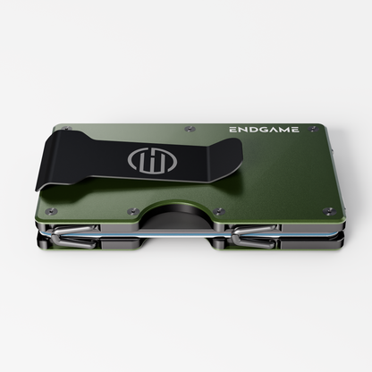 Back of an Endgame Carry aluminum wallet in Verde Selva green, showing the stainless steel money clip and cards held between the plates