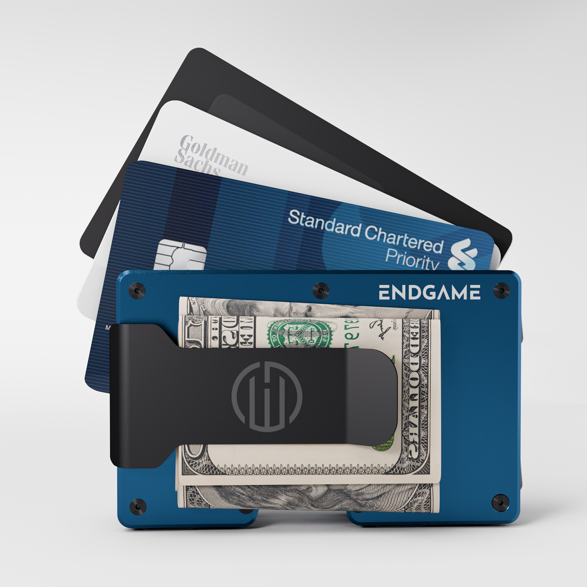 Endgame Carry aluminum wallet in Blu Ionio blue with folded cash in the money clip and cards fanned out behind it