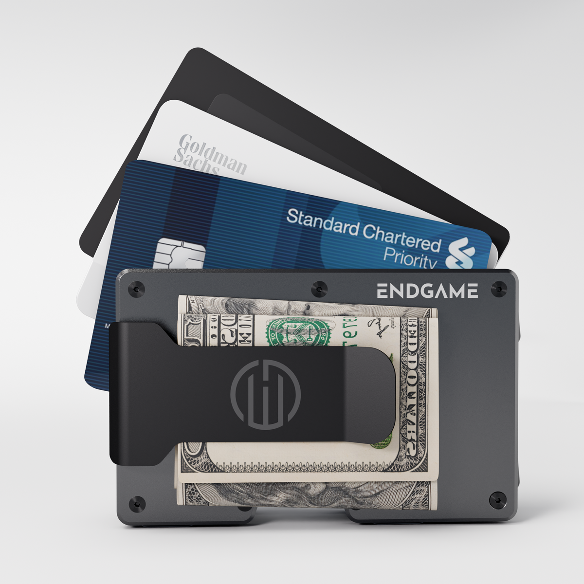 Endgame Carry aluminum wallet in Grigio Ferro grey with folded cash in the money clip and cards fanned out behind it
