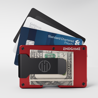 Endgame Carry aluminum wallet in Rosso Apice red with folded cash in the money clip and cards fanned out behind it
