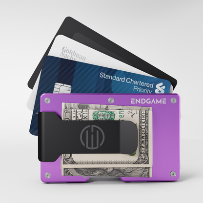 Endgame Carry aluminum wallet in Viola Zefiro purple with folded cash in the money clip and cards fanned out behind it