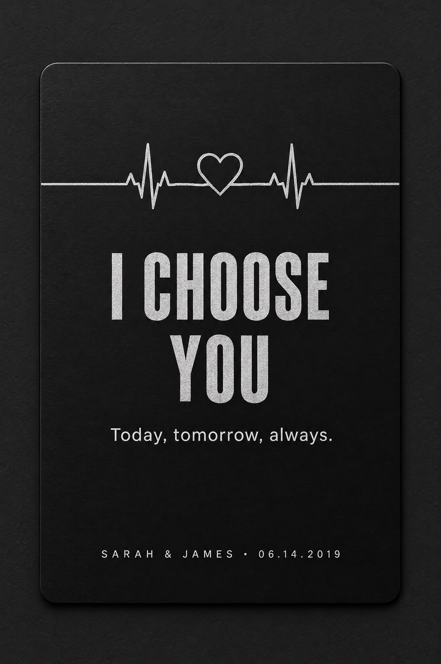 Heartbeat: I choose you, engraved on a black aluminum wallet card