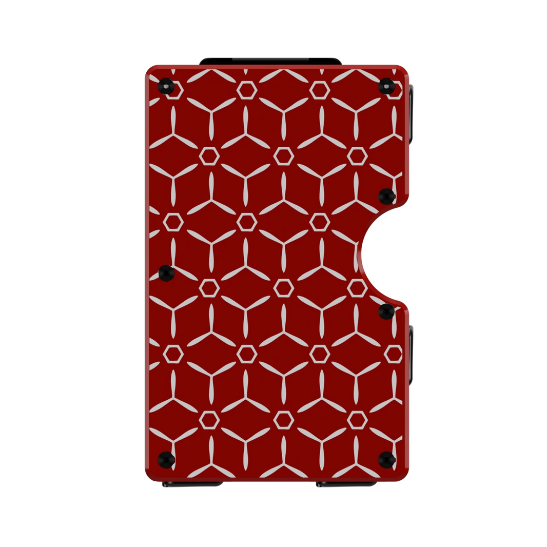 Tritium Weave aluminum wallet in Rosso Apice red, front engraved with a repeating geometric hexagon pattern