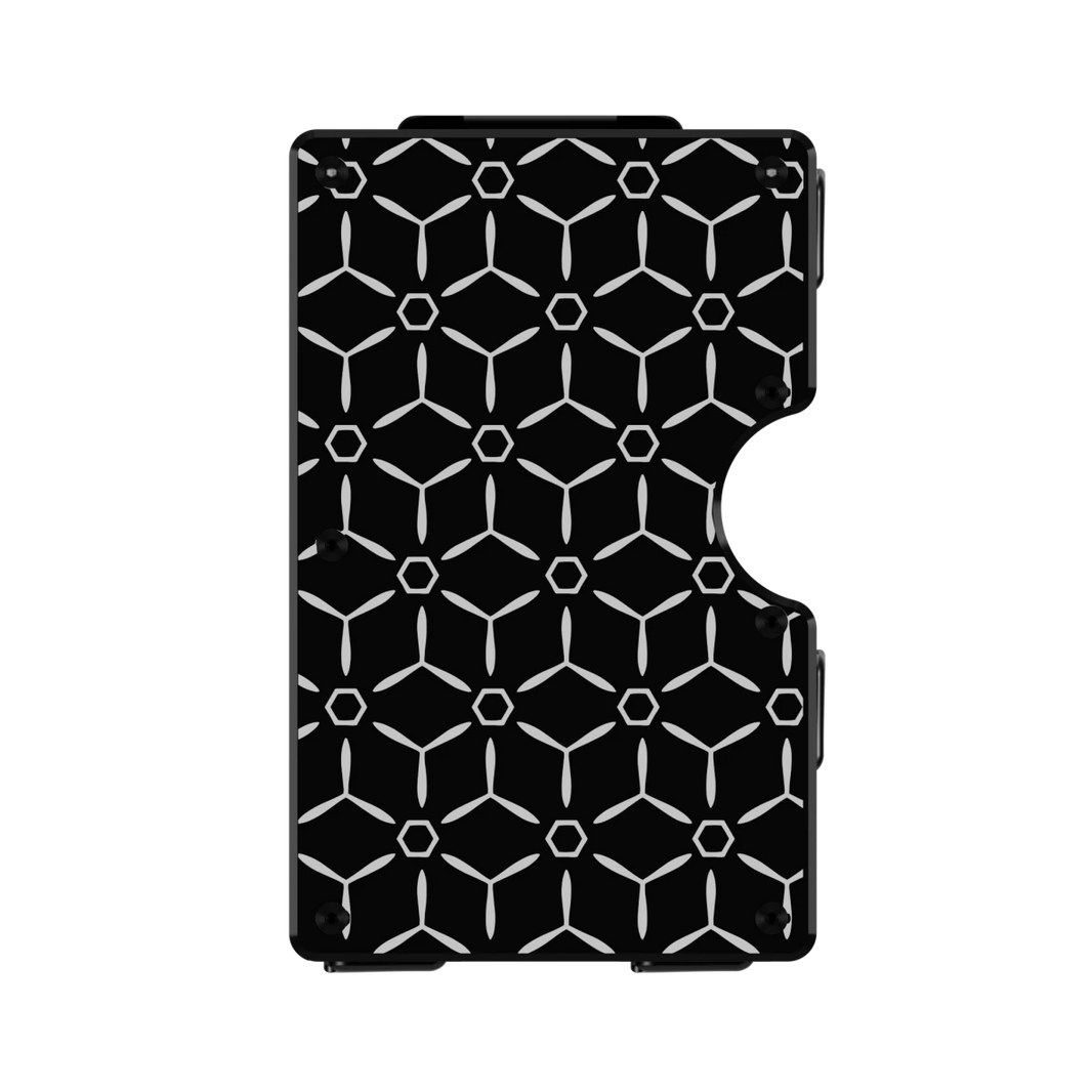Tritium Weave aluminum wallet in Nero Abisso black, front engraved with a repeating geometric hexagon pattern